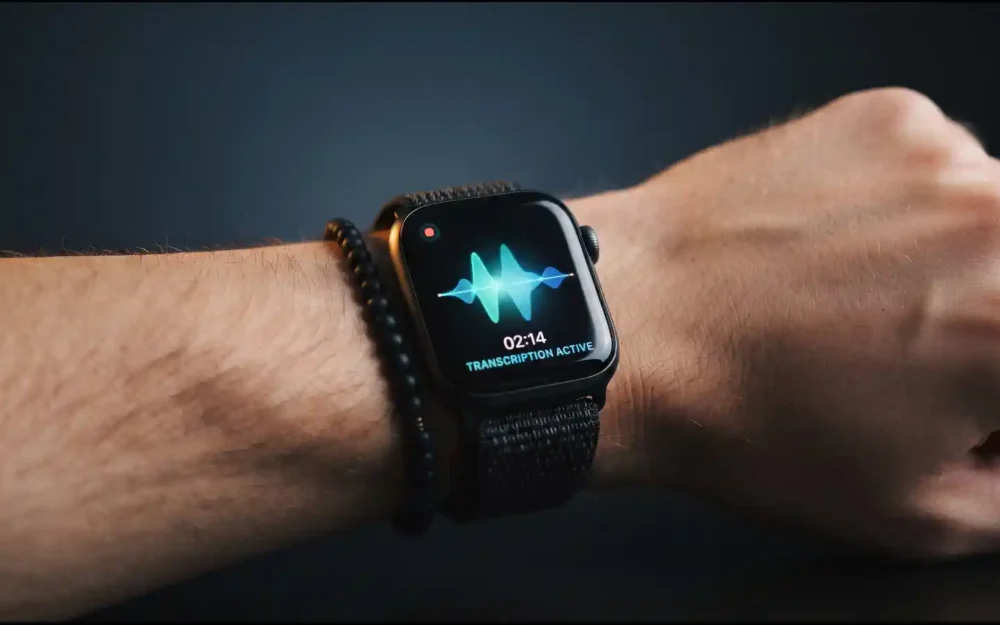Apple Watch showing live transcription, part of Apple Watch's new AI features for conversation recaps