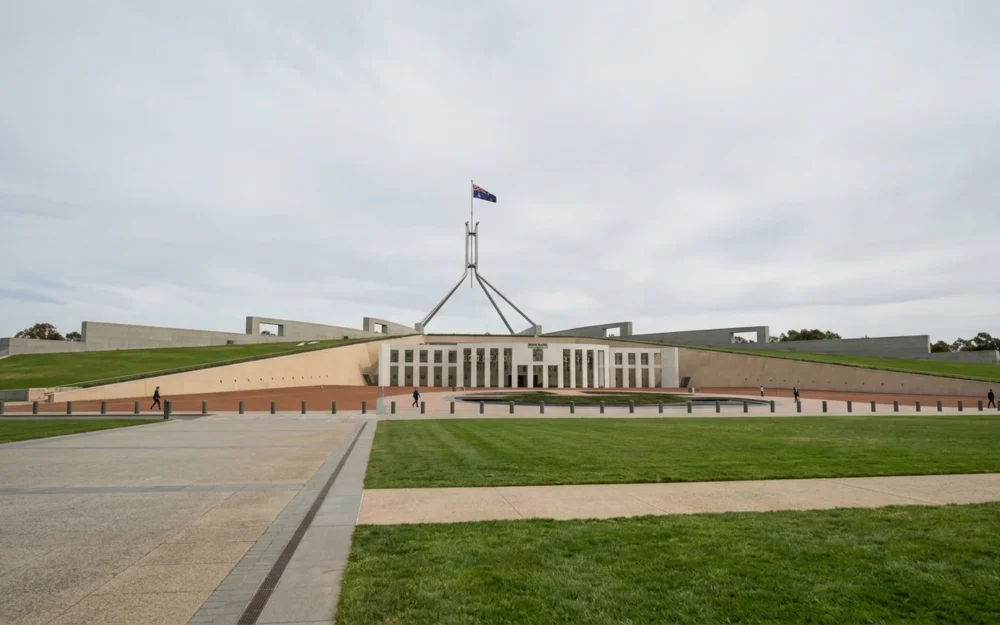 Exterior of Parliament House in Canberra, Australia, under overcast daylight